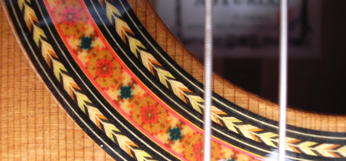 Close up image of a flamenco guitar rosette.
